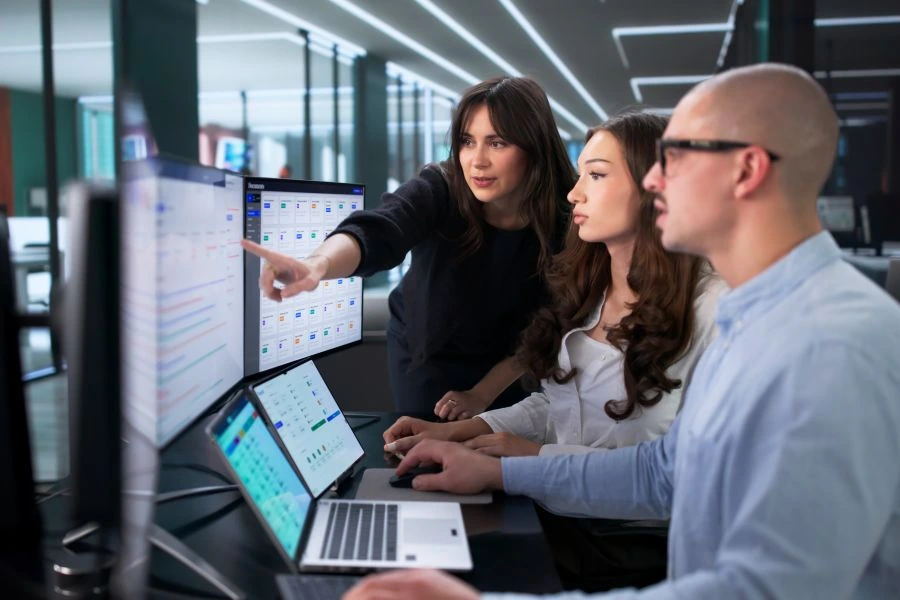 Investors checking metrics on computer